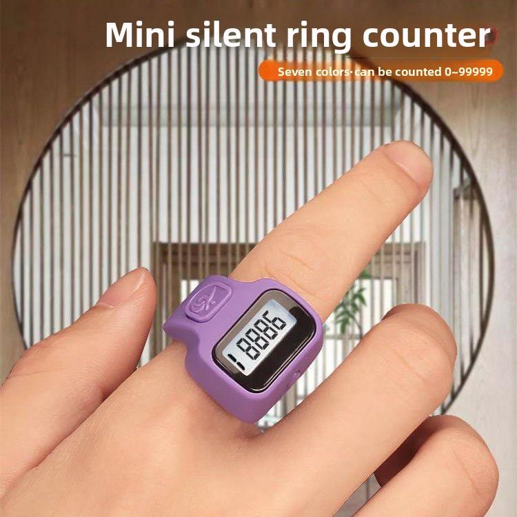 Purple digital tasbih counter worn on a finger showing its display